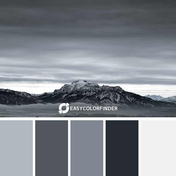 a black and white photo of a mountain range