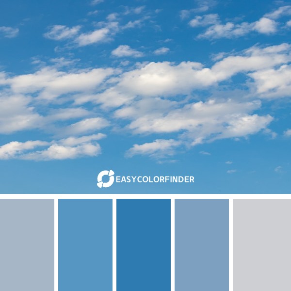 a plane flying through a blue sky with white clouds