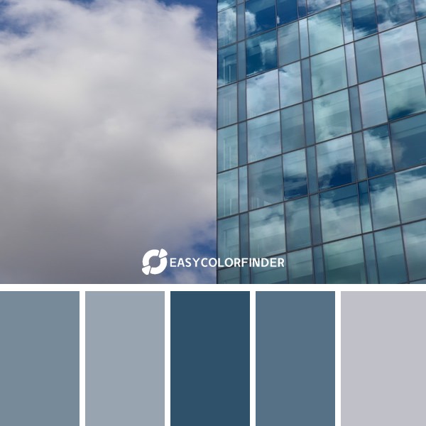 blue and white concrete building under white clouds