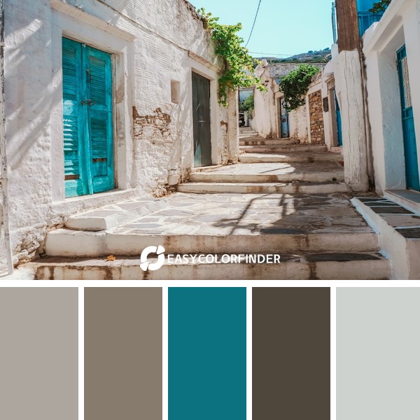 blue wooden door on white concrete building