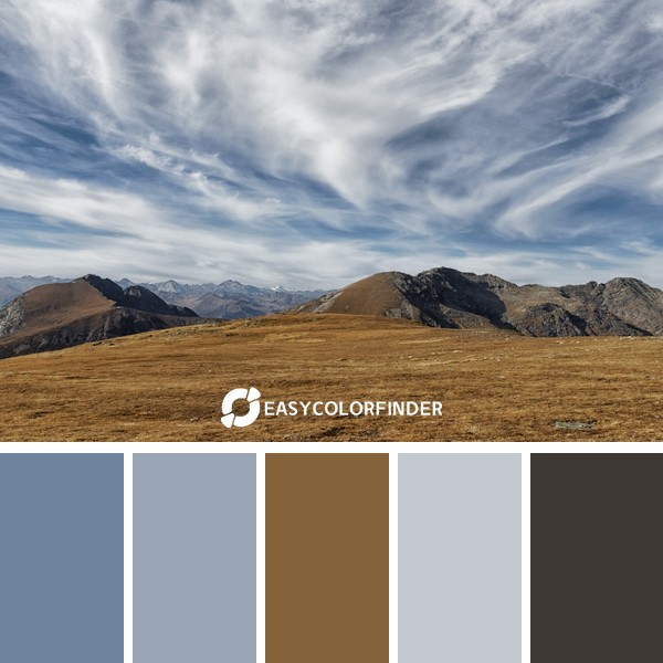 brown cliff with ocean in distance