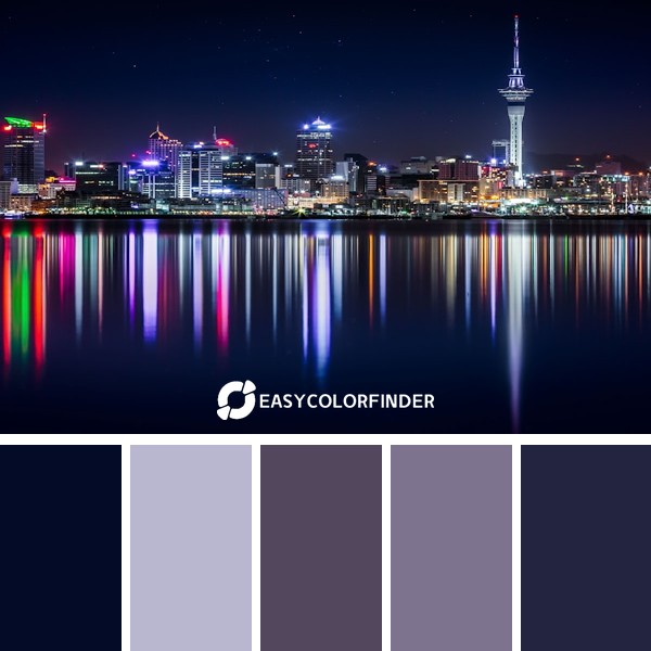city buildings next to sea water during night