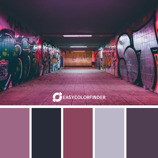 empty tunnel pathway with graffiti walls