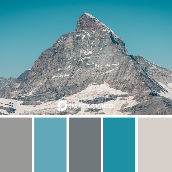 gray rocky mountain under blue sky during daytime