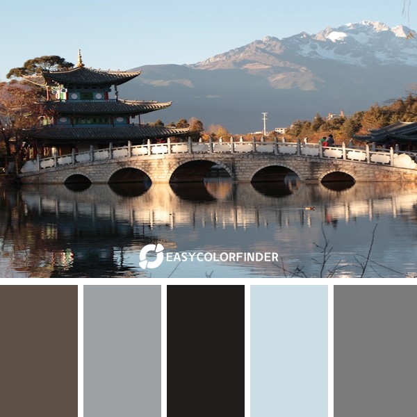 grey concrete bridge tower temple during daytime