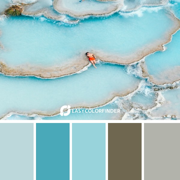 man sitting in body of water