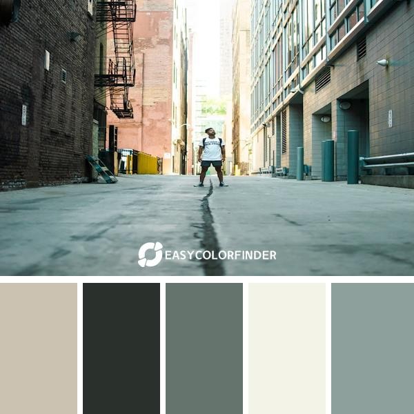 man standing in middle of road during daytime
