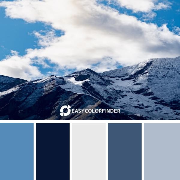 mountain coverwith snow under white and blue sky during daytime