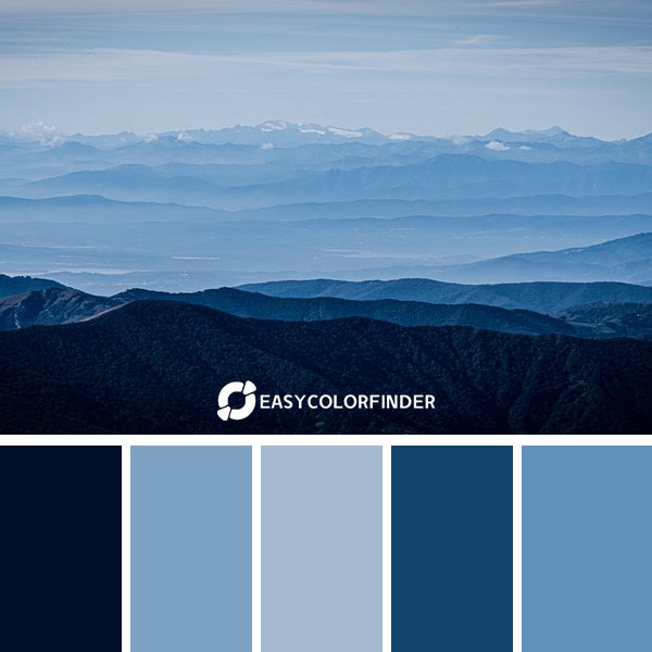 mountains under blue and grey sky
