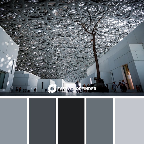 people standing between building wall