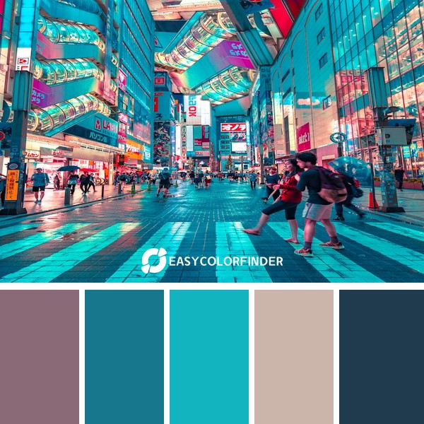 people walking on road near well-lit buildings