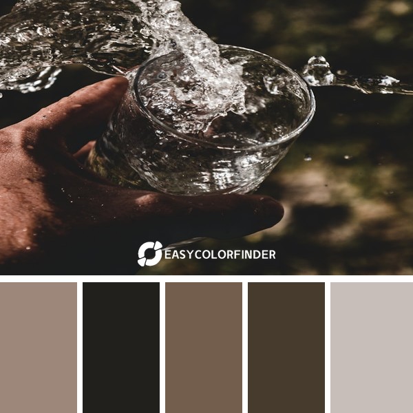 person holding drinking glass fillwith water