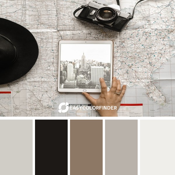 person holding iPad beside SLR camera