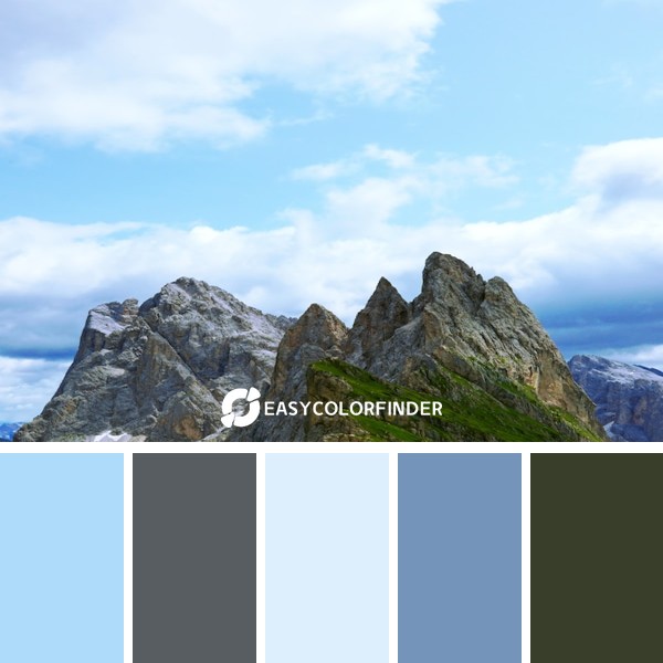 rocky mountain under white clouds during daytime