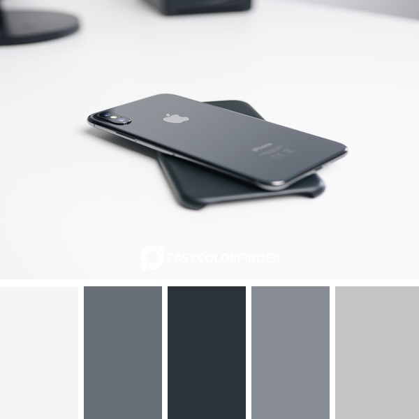 space gray iPhone X on white surface