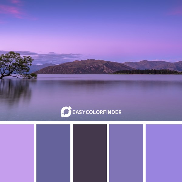 tree on body of water near mountains