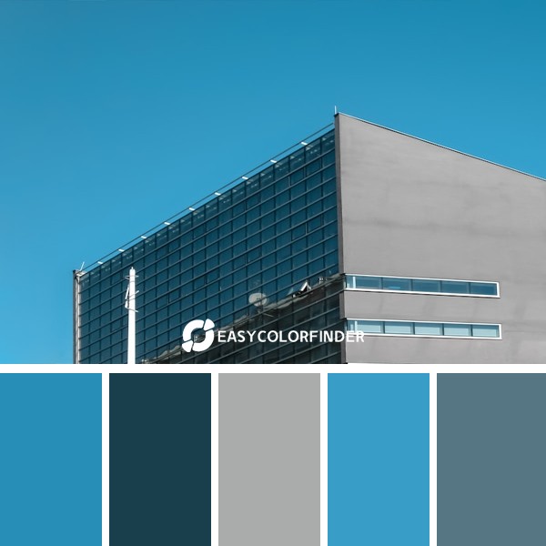 white and black concrete building under blue sky during daytime