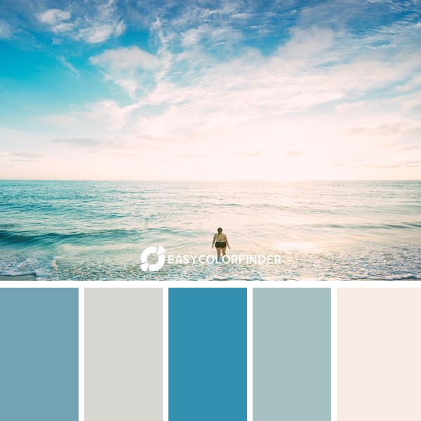 woman on sea in front of sun