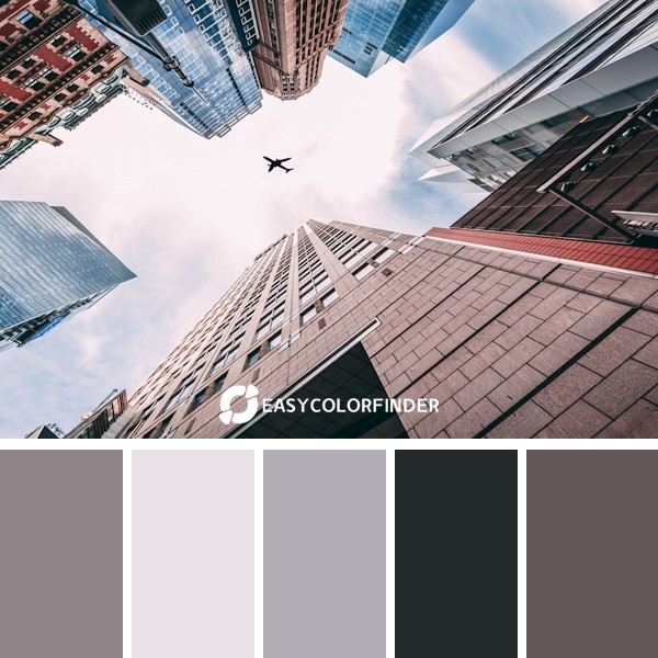 worms-eye view of an airplane flying above city